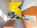 beta-three-generation-house-buiksloterham-photo-interior-kitchen-yellow-staircase-image-Ossip-van-Duivenbode